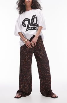 Fierce animal print covers these lightweight pants designed with roomy wide legs and a comfortable elasticized drawstring waist. 29 1/2" inseam; 22" leg opening; 12" front rise; 15" back rise (size ts-8) Elastic/drawstring waist 100% viscose Machine wash, line dry Imported Wide Leg Drawstring Pants, Joni Jeans, Tie Waist Pants, Lightweight Pants, Satin Pants, Print Pants, Pants Design, Straight Leg Trousers, Maxi Dress Trend