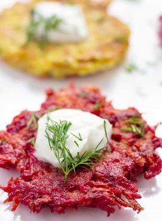 beet and goat cheese appetizers with sour cream on top are ready to be eaten