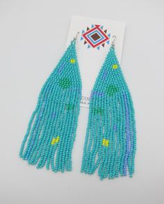 Amazing Modern Powwow Native American Style Boho Seed Bead Earrings with a variety of native colors in a modern non-traditional design. Stainless steel ear wires and genuine high quality beads. A beautiful combination of colors and native design at a super price. At nearly 6 inches in total length these are just amazing. Great to wear alone or to match with your dancing regalia. Cool modern look with a traditional flair. All handmade. Shipped Free to your home or office from Hawaii. Aloha! Traditional Turquoise Beaded Earrings For Festivals, Southwestern Blue Beaded Fringe Earrings, Blue Southwestern Beaded Fringe Earrings, Multicolor Hand-strung Dangle Earrings, Blue Hand-strung Dangle Beaded Earrings, Hand-strung Dangle Earrings For Festivals, Southwestern Green Beaded Dangle Earrings, Southwestern Style Green Earrings With Colorful Beads, Multicolor Hand-strung Bohemian Beaded Earrings