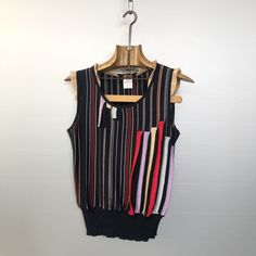 Beautiful vintage top Bazar by Christian Lacroix. Black with red, pale green, pale purple and golden stripes. Ruffled neck and shoulders, designer cut! Material is 80% cotton / 20% viscose Condition is : very good vintage condition Size is L (refer to measurements) MADE IN ITALY Do not hesitate to DM if you have any questions ! shoulder seam to shoulder seam : 31cm / 12,25in Armpit to armpit : 46cm / 18in Front length (collar to bottom) : 42cm /16,5in Back length : 51cm / 20in Retro Cotton Tops For Layering, Multicolor Vertical Striped Tops For Spring, Spring Multicolor Vertical Striped Tops, Multicolor Sleeveless Tops For Layering, Striped Sleeveless Top For Layering, Sleeveless Striped Tops For Layering, Pale Purple, Corduroy Blazer, Christian Lacroix