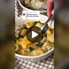 two bowls filled with pasta and spinach on top of a checkered table cloth