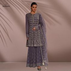 Versatile for Festive & Wedding Wear: Ideal for bridesmaids, wedding guests, or anyone looking to shine at festive events like Diwali, Eid, or parties. Embroidered Wedding Fabric With Dori Work, Elegant Embroidered Sharara For Celebration, Embroidered Sharara For Wedding And Eid, Purple Lehenga With Chikankari Embroidery For Wedding, Purple Chikankari Wedding Lehenga, Purple Wedding Lehenga With Chikankari Embroidery, Purple Embroidered Fabric For Wedding And Eid, Purple Embroidered Wedding Sets, Embroidered Purple Wedding Sets