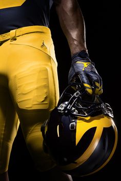 a close up of a football player's uniform with his helmet and gloves on