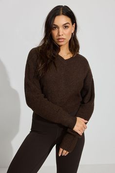 Phone on do-not-disturb, cozy sweater on, vibing. Features - Rib knit - Super soft <3 Size & Fit - Fit: Fitted - Length: Cropped - Model is wearing size S Materials & Care - Content: 50% recycled polyester, 46% polyester, 4% spandex - Care: Machine wash, cold - Imported Brown Knit V-neck Sweater For Winter, Brown V Neck Sweater, Brown Knit Sweater Cropped, Brown Knit V-neck Sweater With Long Sleeves, Cozy Brown Knit V-neck Sweater, French Roast, Sweater Brown, Fuzzy Sweater, Cozy Sweater