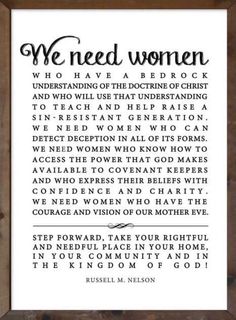 a framed print with the words we need women in black and white, against a wooden frame