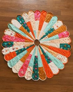 a circular piece of fabric sitting on top of a wooden floor