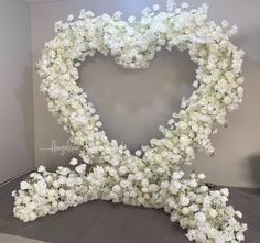 white flowers arranged in the shape of a heart