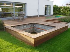 a wooden deck that has been built into the ground