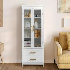 a white cabinet with glass doors in a living room