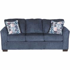 a blue couch with two pillows on the arm and one pillow on the other side