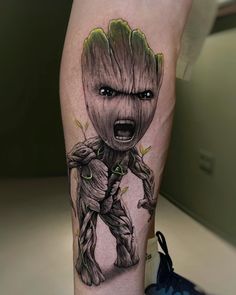 a person with a tattoo on their leg that has an image of groote