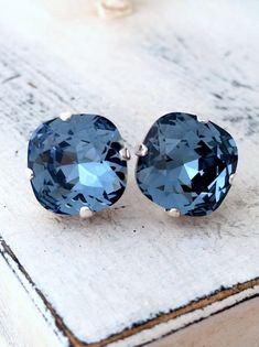 "Navy blue deep blue crystal stud earrings, Bridesmaids jewelry, European stud earrings, Bridal earrings, Silver or Gold, Stud or drop These earrings are so sweet and romantic. Perfect gift for bridesmaids or any available other occasion. They are made silver plated brass and Swarovski crystals, set in prong setting. Made with CRYSTALLIZED™ - high quality genuine SWAROVSKI CRYSTALS The center stone has a cushion fancy cut - real elegant. SIZE: 12 mm AVAILABLE ALSO IN GOLD VERSION, STUD OR DROP V Bridal Earrings Silver, Blue Bridal Earrings, Bridal Earrings Studs, White Opal Earrings, Bridesmaids Jewelry, Personalized Leather Bracelet, Jewelry Swarovski, Swarovski Crystal Jewelry, Diy Tattoo