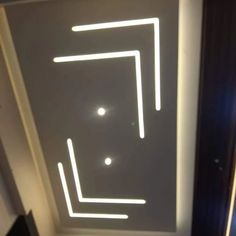 the ceiling is lit up with white lights