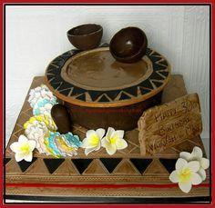 there is a cake that looks like it has been decorated with fondant and flowers