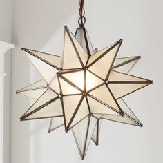 a moravian star light hanging from the ceiling