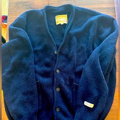 Like New, Never Laundered. Never Worn Outside, Only Worn A Few Times. Blue Wool V-neck Outerwear, Cozy Blue Cardigan With Pockets, Blue Wool Cardigan For Fall, Blue Wool Winter Cardigan, Blue Wool Cardigan For Winter, Classic Blue Knit Outerwear, Blue Wool Long Sleeve Cardigan, Cozy Blue Cardigan With Button Closure, Classic Blue Sweater With Pockets