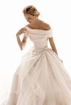 a woman in a white wedding dress on her cell phone with the caption pinterest