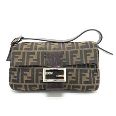 Item Information ITEM NO.: G-210225-10 NAME: FENDI FF logo Zucca pattern Mamma Baguette Flap shoulder bag Shoulder Bag SHAPE: Shoulder Bag MODEL NO.: 2321.26424 COLOR: BrownBasedxSilverHardware MATERIAL: Canvas/Leather APPROX SIZE: W9.9×H5.5×D1.5inch / W25.2cm×H14cm×D3.8cm The Shoulder part is adjustable. Listed hand measurements may have a 1-2cm difference. Gender: Women's Spec: [Open type]Magnet type [Inside] Zipper pocket x 1 ADDITIONAL ITEMS: None ITEM RANK: Used AB Rank CONDITION DETAILS: O Brown Monogram Canvas Baguette Bag, Designer Brown Baguette Bag, Brown Monogram Canvas Bag With Logo Hardware, Brown Monogram Canvas Bags With Logo Hardware, Brown Monogram Canvas Shoulder Bag With Logo Hardware, Rectangular Monogram Canvas Bag With Logo Hardware, Monogram Canvas Shoulder Bag With Logo Hardware, Designer Baguette Shoulder Bag With Branded Hardware, Formal Monogram Canvas Shoulder Bag With Logo Hardware