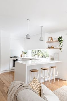 the kitchen is clean and ready to be used as a living room or dining area