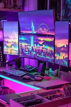 three computer monitors sitting on top of a desk