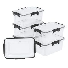 three clear storage containers with black handles