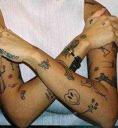 a woman with many tattoos on her arms