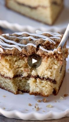 a piece of cake on a plate with a fork in it and another slice missing