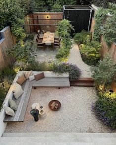 an aerial view of a small backyard garden with seating and table set up in the middle