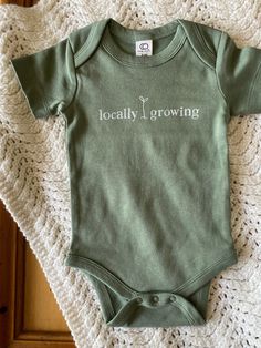 Locally Growing Organic Cotton Baby Onesie Light Sage - Etsy Fitted Organic Cotton Casual Bodysuit, Fitted Casual Organic Cotton Bodysuit, Fitted Cotton Bodysuit For Everyday Wear, Everyday Fitted Cotton Bodysuit, Spring Casual Organic Cotton Bodysuit, Spring Cotton Bodysuit With Relaxed Fit, Green Cotton Onesie For Spring, Spring Organic Cotton Fitted Bodysuit, Cotton Onesie Gift For Spring