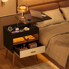 a bed room with a neatly made bed and a laptop on a desk next to it