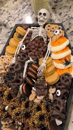 a tray filled with halloween treats on top of a table