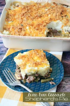 a casserole dish with meat and cheese in it on a blue plate next to a fork