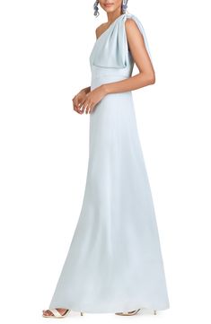 Subtly angle for attention in this satin-charmeuse gown with a waistline seamed to parallel the neckline and a bow detail with a large draping one shoulder. 61" regular length (size 8) Hidden side-zip closure One-shoulder neck Sleeveless Lined 100% polyester Dry clean Imported Asian Owned/Founded One Shoulder Gown With Pleated Bodice For Evening, Elegant One-shoulder Bias Cut Wedding Dress, Elegant One-shoulder Wedding Dress With Bias Cut, Elegant Bias-cut One Shoulder Wedding Dress, Elegant Bias Cut One-shoulder Wedding Dress, Elegant Bias Cut One Shoulder Wedding Dress, Elegant One-shoulder Dress With Satin Finish For Wedding, One Shoulder Wedding Dress With Ruched Bodice, One-shoulder Satin Finish Dress For Wedding