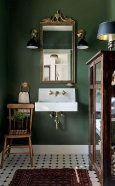 a bathroom sink sitting under a mirror next to a wooden cabinet and chair in front of it