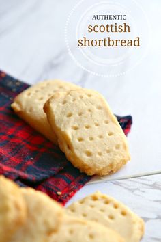 two shortbread crackers sitting on top of a cloth