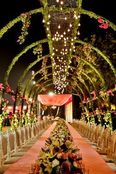 a long table is set up with flowers and chairs for an outdoor wedding or reception