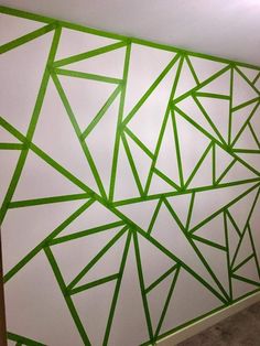 a white wall with green lines painted on it