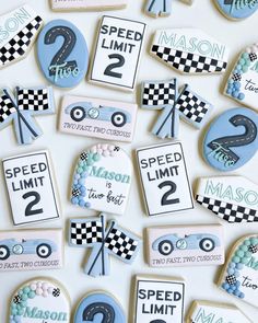 decorated cookies with race cars and numbers on them for a birthday or baby's first birthday