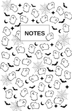 halloween themed notebook with ghost faces and bats on the cover, in black and white