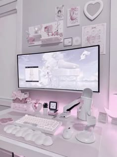 a white desk with a computer monitor and keyboard