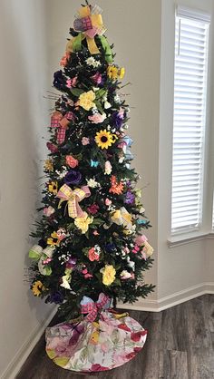 a decorated christmas tree in the corner of a room