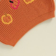 Get your little one into the Halloween spirit with our Halloween Embroidered Knitted Sweater. This cozy knitted sweater is the perfect addition to their autumn wardrobe, featuring an adorable "pumpkin" embroidered letter design. Available in both autumn and orange, it adds a festive touch to their seasonal outfits. Crafted with care, this sweater is made from high-quality materials to keep your child warm and comfortable during the cooler months. The knitted fabric provides excellent insulation Cute Acrylic Sweater For Fall, Cute Cotton Sweater Vest For Fall, Playful Cotton Sweater For Fall, Playful Soft Knit Sweater For Fall, Cute Fall Cable Knit Sweater, Cute Cable Knit Fall Sweater, Cute Cable Knit Sweater For Fall, Cute Fall Sweater With Knitting Details, Fall Cotton Orange Sweater