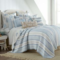 PRICES MAY VARY. THE IPANEMA DESIGN: One of our most popular quilt sets, Ipanema is inspired by a charming beachfront cottage, with a printed textured stripe in shades of blue and taupe and a charming reverse pattern of taupe and blue coral. A bound border provides contrast and texture to complete the look. The matching shams are randomly cut from the same fabric as the quilt, making each sham unique and not identical to any other sham. SOFT AND COMFORTABLE LUXURY: Made from 100% cotton and fill California King Quilts, Coastal Quilts, Oversized Quilt, King Quilt Sets, King Pillow, Luxury Quilts, Medallion Quilt, Brown Teal, King Pillows