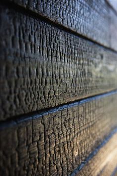 close up view of wood grain on the side of a building