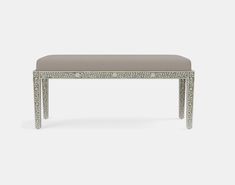 The Miranda bench is an ideal way to finish off a space with a touch of the feminine. The inlaid bone of the base can be paired with any of our upholstered cushion options, creating a lovely graphic detail for a number of uses-try it in a woman's vanity or an entry room, under a console, or at the base of a bed. Inlaid bone of the base Sleek design complements any decor Upholstered seat Available Sizes:Small - 24"W x 18"D x 20"HLarge - 48"W x 18"D x 20"H Seat Depth: 17"Cushion height may vary fr Entry Room, Planter Beds, Accent Tray, Accent Seating, Carving Board, Luxury Dinnerware, Wall Art Wallpaper, Sideboard Console Table, Acrylic Decor