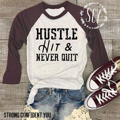 a shirt that says hustlen't and never out on it, next to sneakers