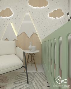 a baby's room with mountains and clouds painted on the walls, along with a crib