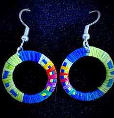 1 inch circle -shaped earrings made with colorful porcupine quills by native artist, Chuck Mesteth Colorful Round Earrings Gift, Colorful Round Earrings For Gift, Unique Multicolor Small Hoop Earrings, Rainbow Round Earrings For Pierced Ears, Handmade Rainbow Round Earrings, Handmade Round Rainbow Earrings, Handmade Rainbow Round Jewelry, Handmade Round Rainbow Jewelry, Colorful Handmade Round Jewelry