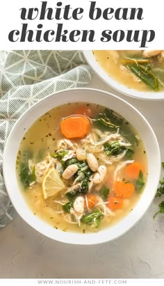 two white bowls filled with chicken and vegetable soup