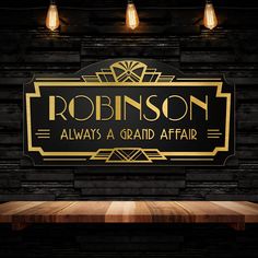 a black and gold sign that says robinson always a grand affair on the side of a brick wall